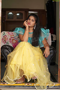 Anusha in Yellow Lehenga and Blue Crop Top