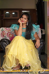 Anusha in Yellow Lehenga and Blue Crop Top