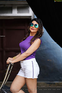 Nisha Singh Rajput in Purple Crop Top and White Shorts