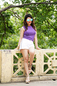 Nisha Singh Rajput in Purple Crop Top and White Shorts
