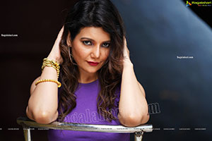 Nisha Singh Rajput in Purple Crop Top and White Shorts