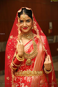 Drishika Chander in Bridal Red and Stunning Ornaments