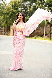 Manjusha in Light Pink Georgette Floral Saree