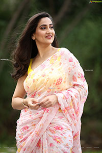 Manjusha in Light Pink Georgette Floral Saree