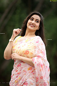 Manjusha in Light Pink Georgette Floral Saree