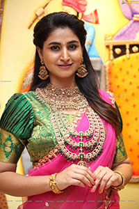 Varshini Sounderajan Poses With Gold Jewellery