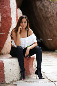 Dhriti Patel in White One-shoulder Ruffled Crop Top