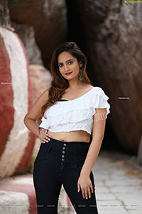 Dhriti Patel in White One-shoulder Ruffled Crop Top