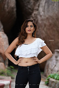 Dhriti Patel in White One-shoulder Ruffled Crop Top