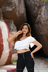 Dhriti Patel in White One-shoulder Ruffled Crop Top