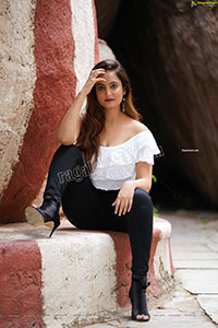 Dhriti Patel in White One-shoulder Ruffled Crop Top