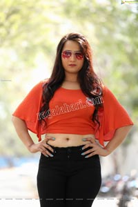 Preyasi Jiggar in Orange Crop Top and Black Torn Jeans