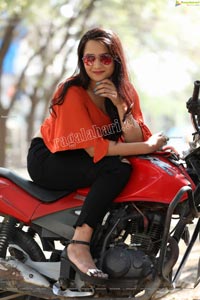 Preyasi Jiggar in Orange Crop Top and Black Torn Jeans