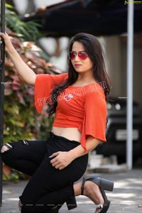 Preyasi Jiggar in Orange Crop Top and Black Torn Jeans