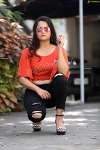 Preyasi Jiggar in Orange Crop Top and Black Torn Jeans