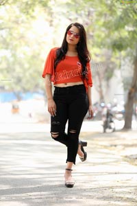 Preyasi Jiggar in Orange Crop Top and Black Torn Jeans