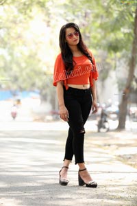 Preyasi Jiggar in Orange Crop Top and Black Torn Jeans