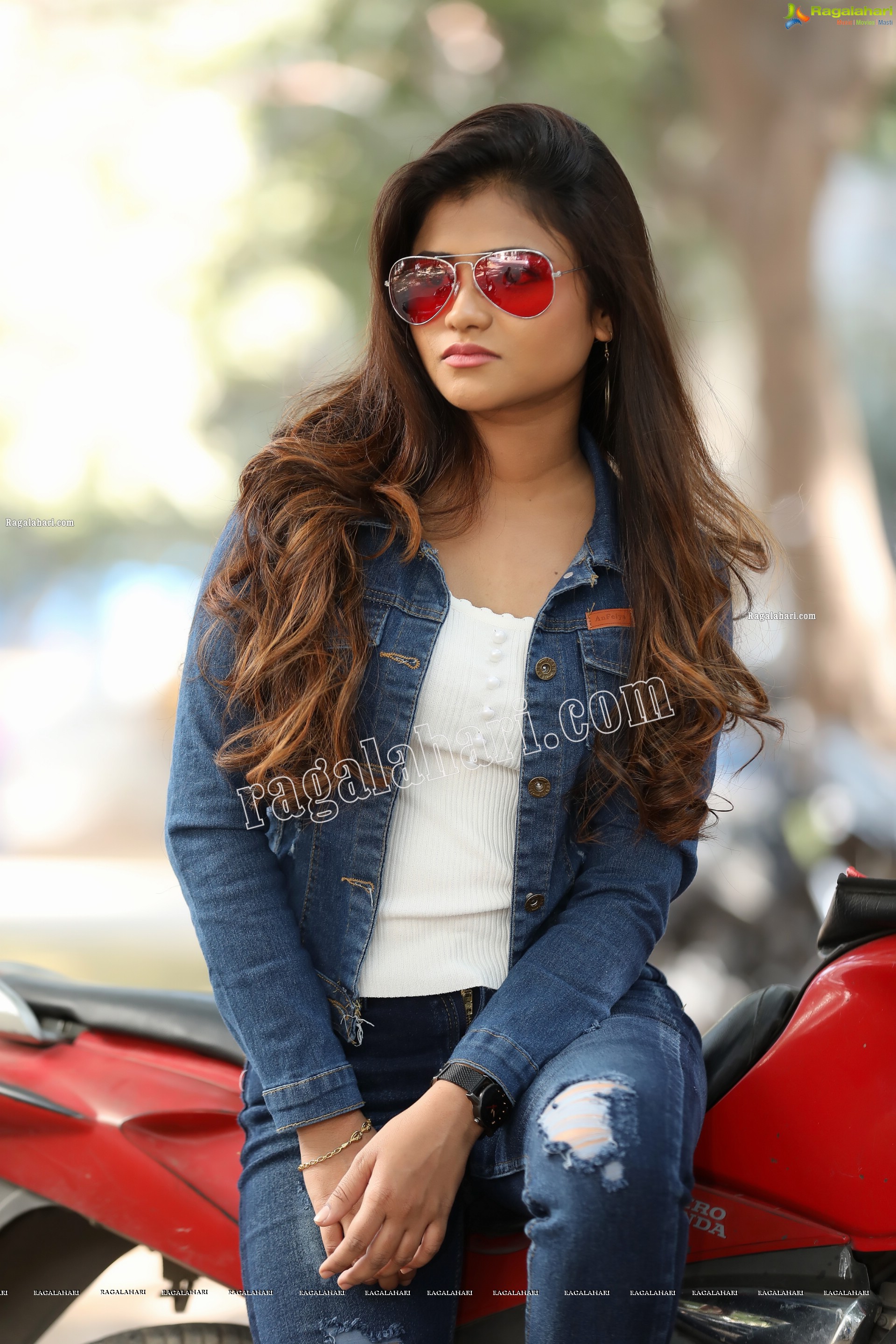 Rishika Nisha Posing on Motorcycle Exclusive Photo Shoot