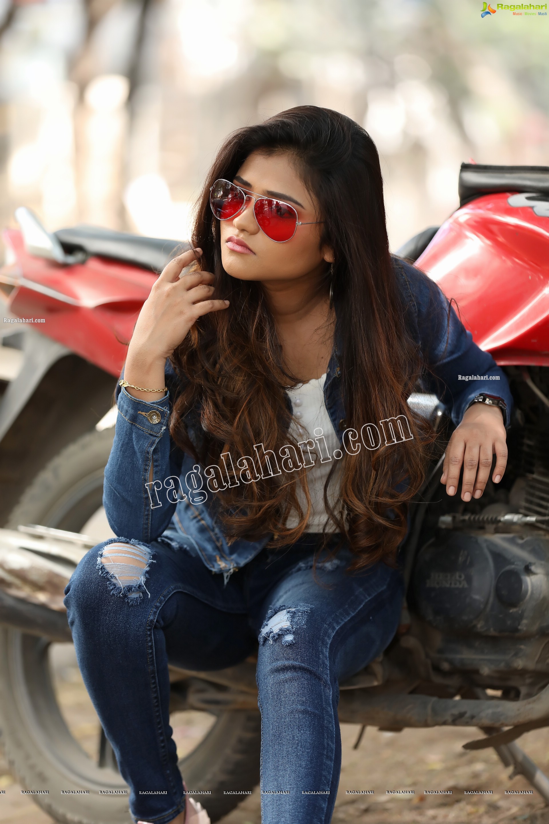 Rishika Nisha Posing on Motorcycle Exclusive Photo Shoot