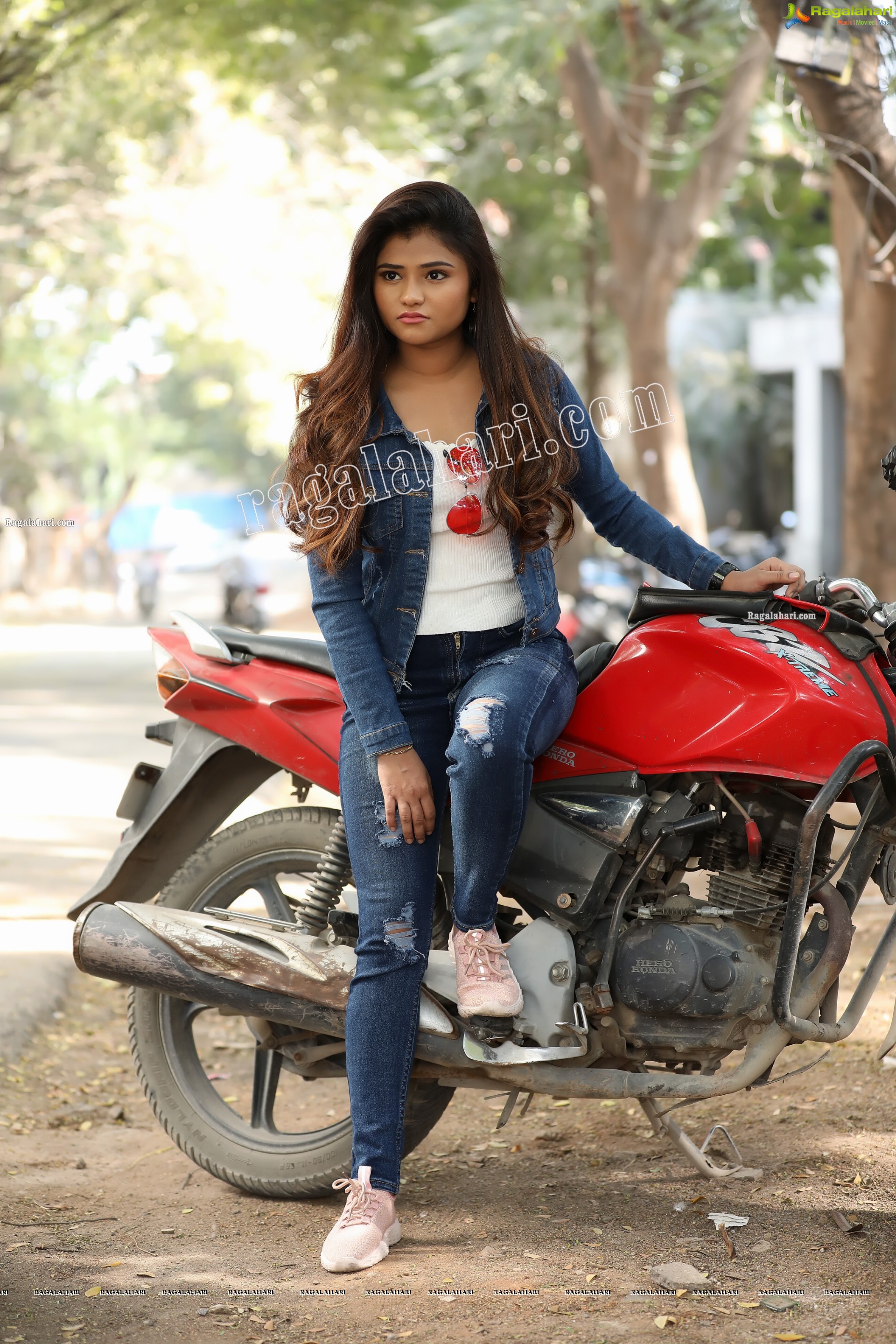 Rishika Nisha Posing on Motorcycle Exclusive Photo Shoot