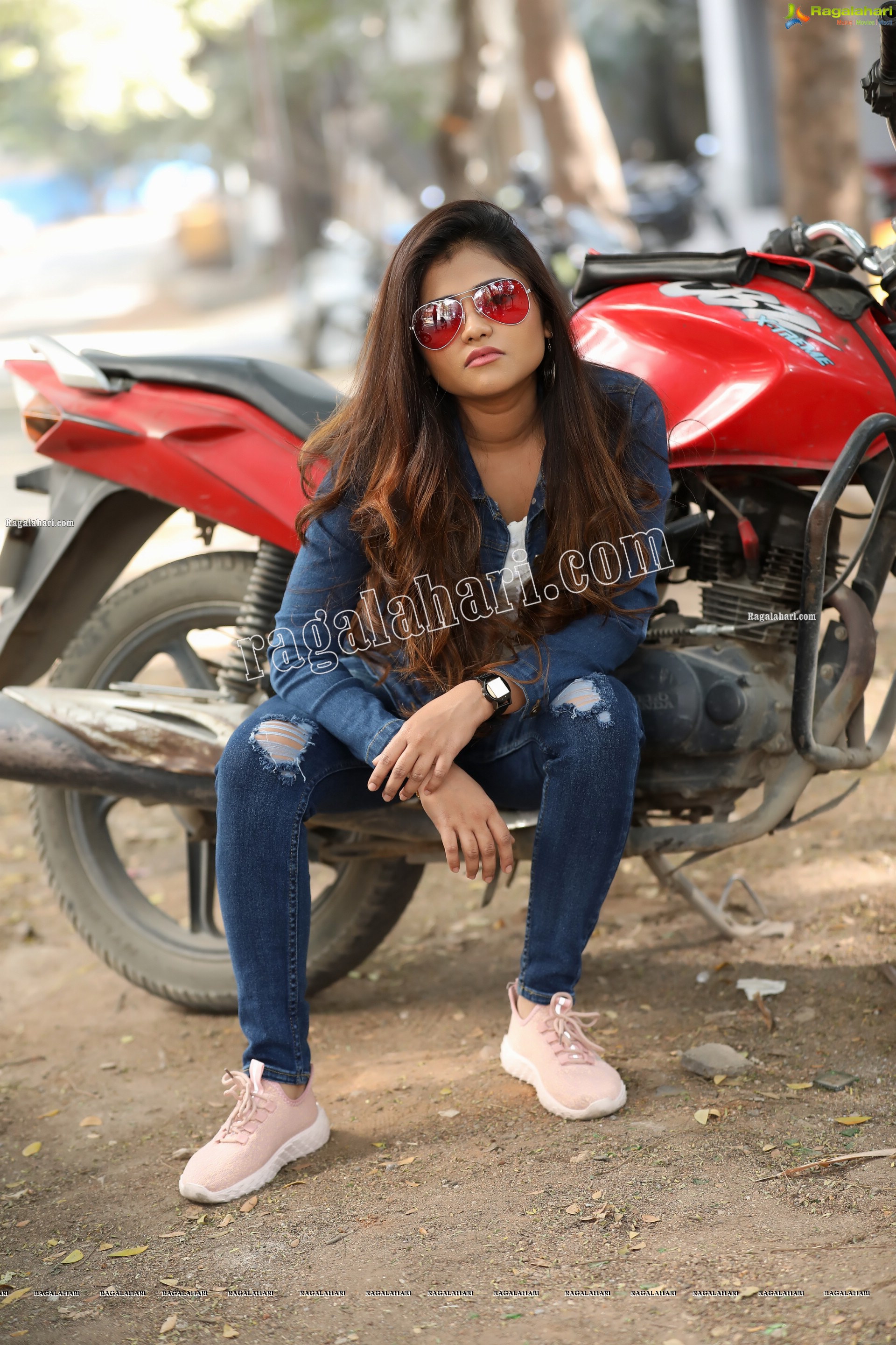 Rishika Nisha Posing on Motorcycle Exclusive Photo Shoot