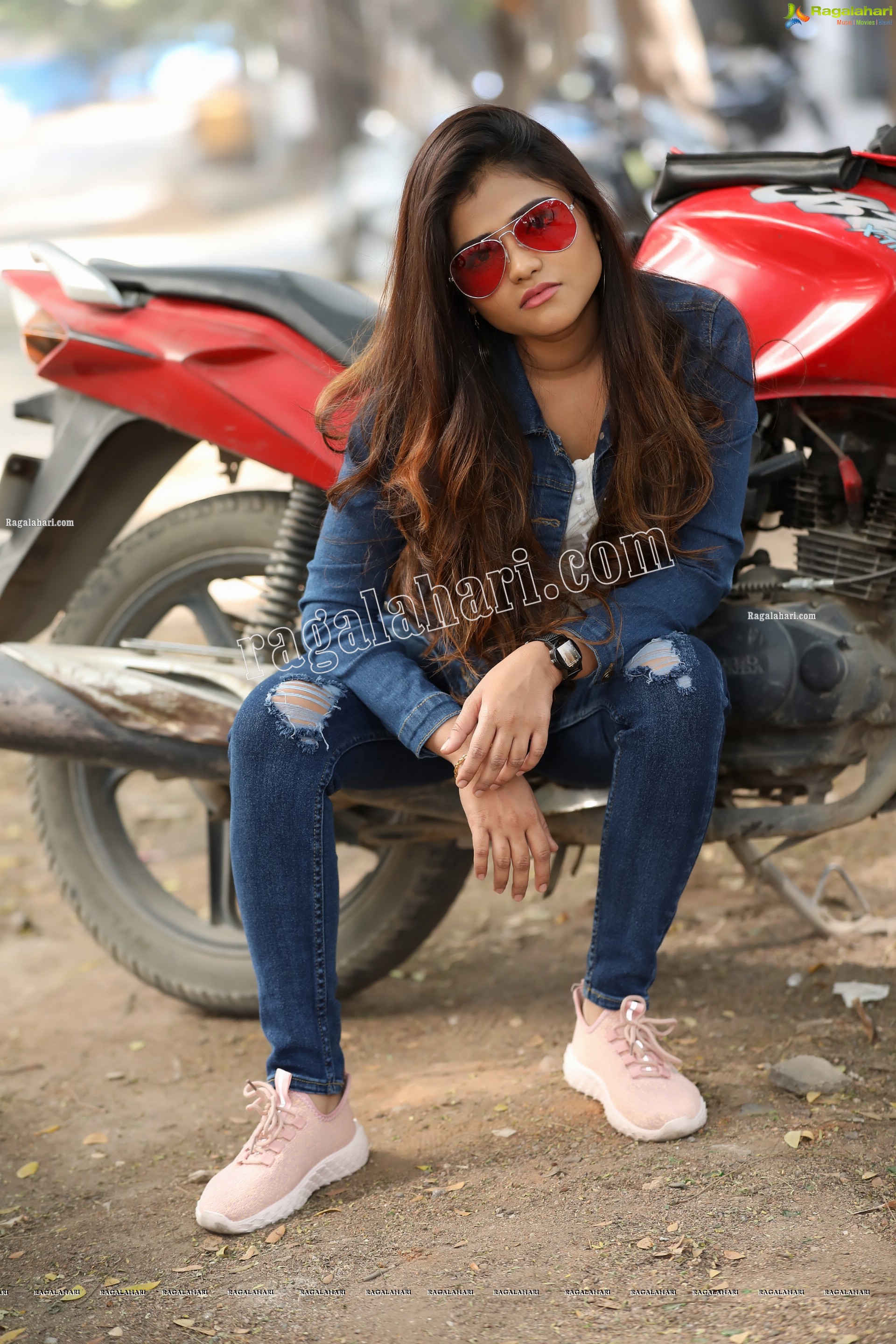 Rishika Nisha Posing on Motorcycle Exclusive Photo Shoot