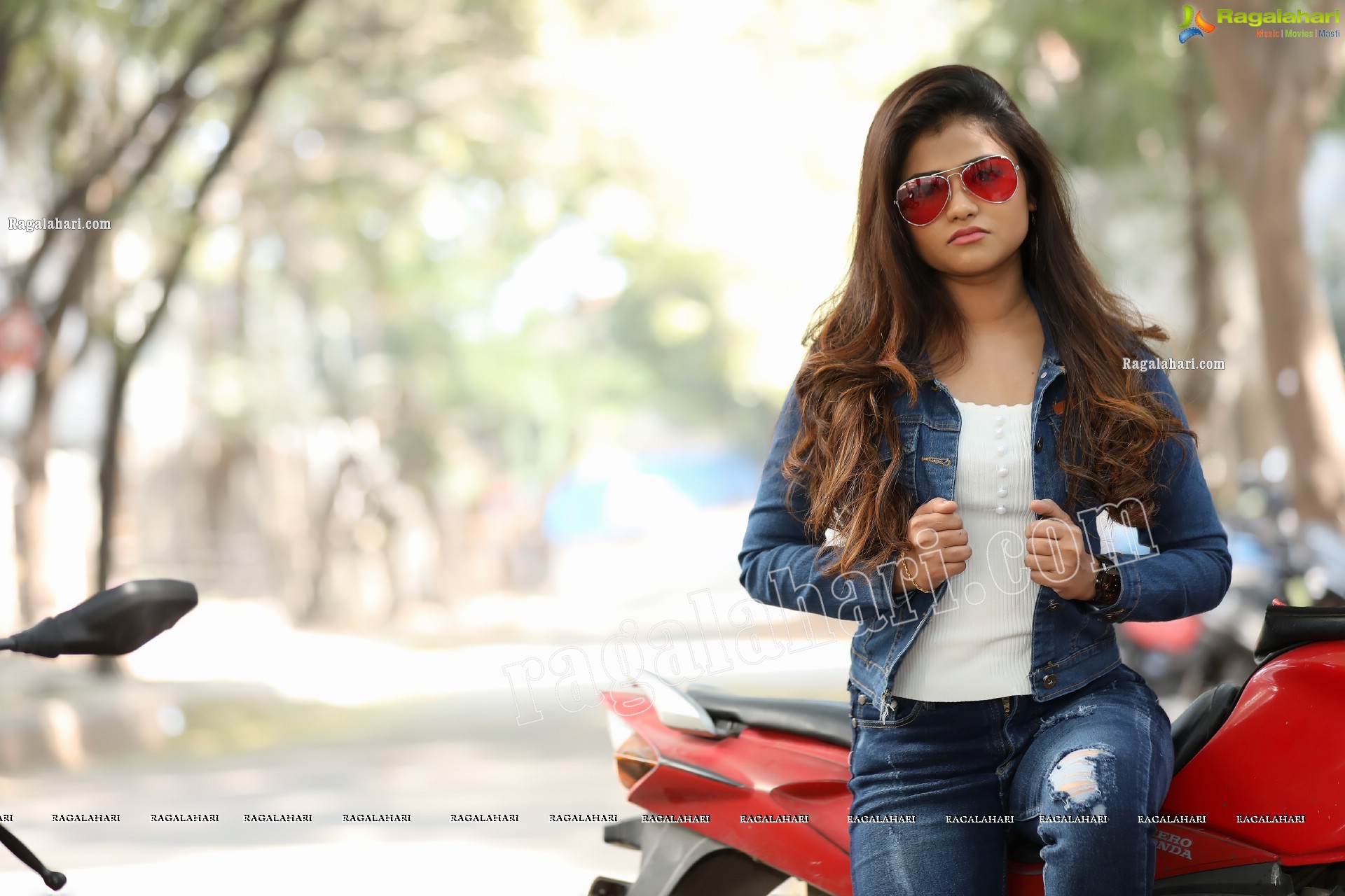 Rishika Nisha Posing on Motorcycle Exclusive Photo Shoot