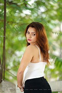 Pranita Waghchoure in Black Ripped Pant and White Tank Top