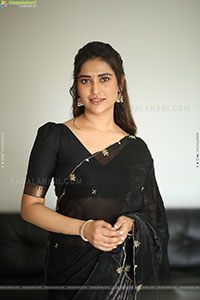 Dhashvika Gorgeous stills in Black Half Saree