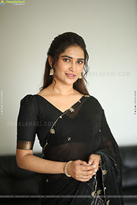 Dhashvika Gorgeous stills in Black Half Saree