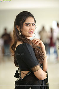 Dhashvika Gorgeous stills in Black Half Saree