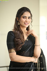 Dhashvika Gorgeous stills in Black Half Saree