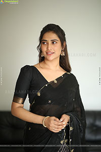 Dhashvika Gorgeous stills in Black Half Saree