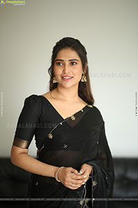 Dhashvika Gorgeous stills in Black Half Saree