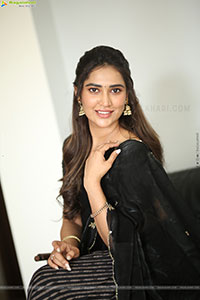 Dhashvika Gorgeous stills in Black Half Saree
