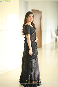 Dhashvika Gorgeous stills in Black Half Saree