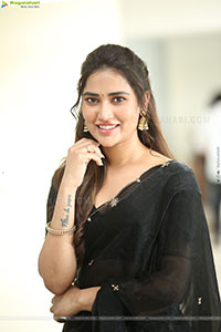 Dhashvika Gorgeous stills in Black Half Saree