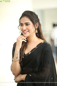 Dhashvika Gorgeous stills in Black Half Saree