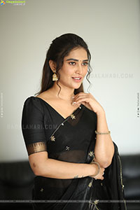 Dhashvika Gorgeous stills in Black Half Saree